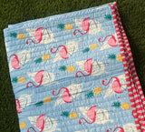 KalaIndia Flamingo Sky Baby Quilt (Blue) – handmade baby quilts india (styled in a nursery/crib)