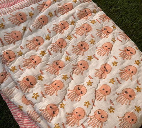 KalaIndia Jellyfish Friends Baby Quilt (Orange) – baby quilts India (flat lay view)