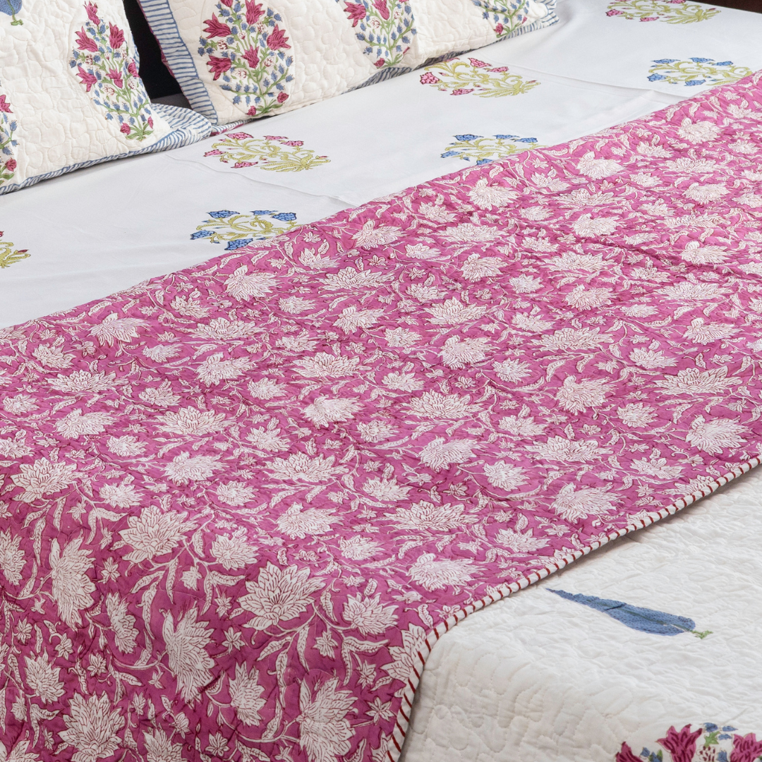 KalaIndia Floral Pink Bedcover – quilted bed sheets (styled on a bed)