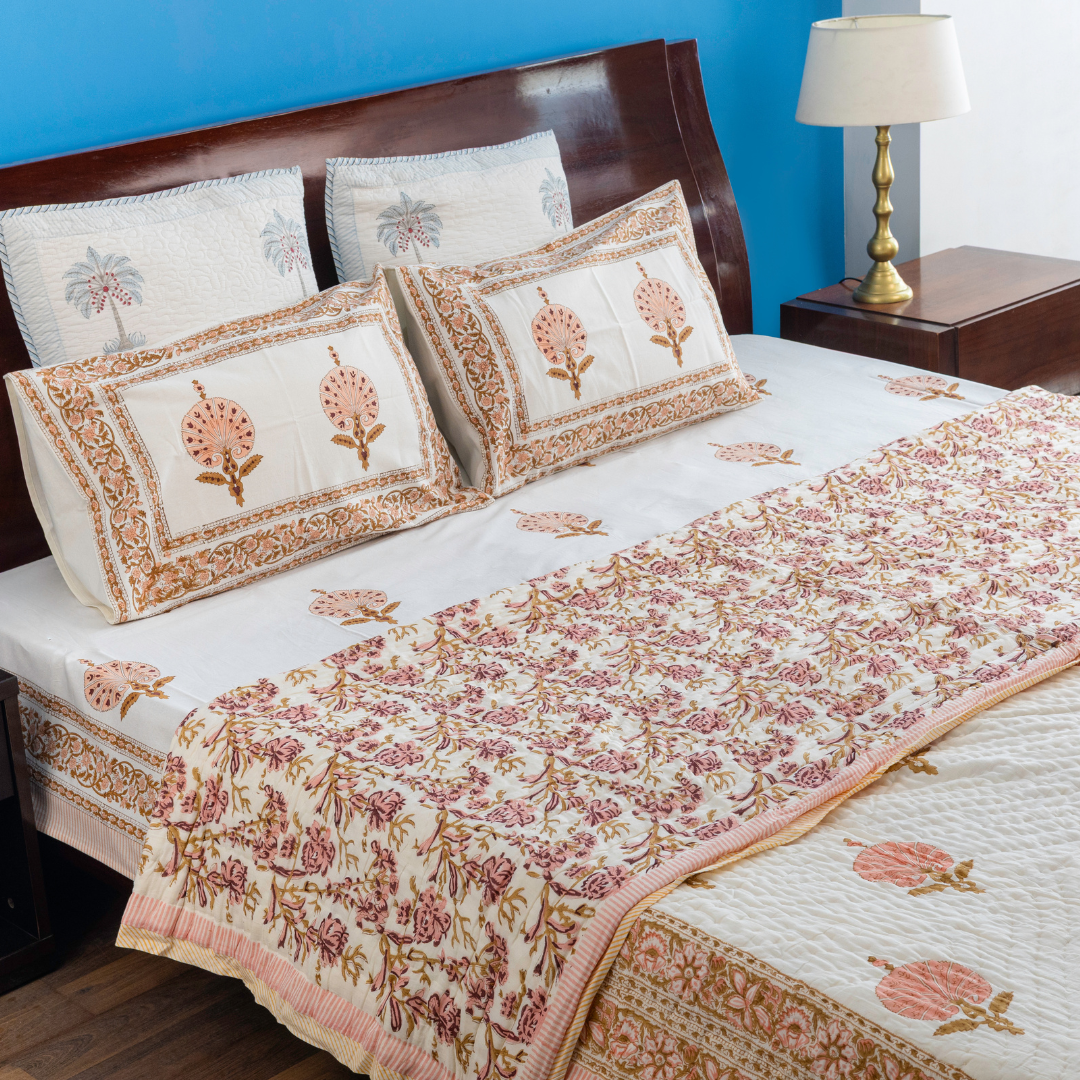 KalaIndia Peach Print Quilt – cotton quilt blanket (flat lay view)