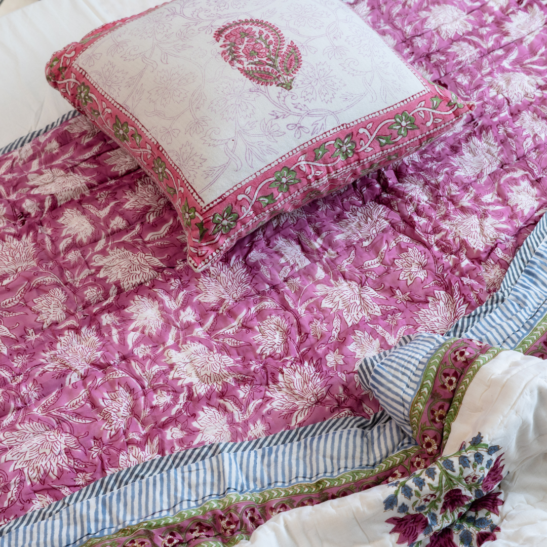 KalaIndia Pink Floral Quilt (Single) – cotton quilt blanket (styled on a bed)